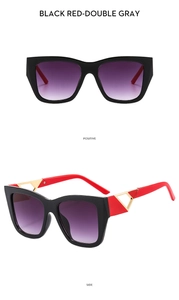 Detail view of square sunglasses with black red frame and purple gradient lenses