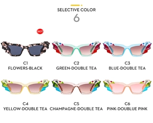 Dettaglio di sei occhiali da sole cat-eye alla moda in varie colorazioni di cristallo