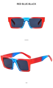 Front and side view of rectangular color-block sunglasses in vibrant red and navy blue
