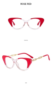 Detail of rose red cat-eye glasses frame with gold chain temples on white background