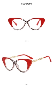 Detail of red demi cat-eye frames with side-view showing golden chain temple structure