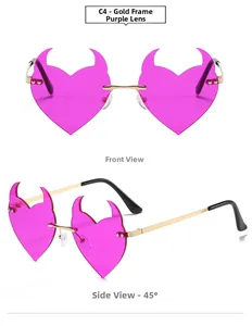 Detail view of heart devil-horn sunglasses with gold metal frame and purple lenses