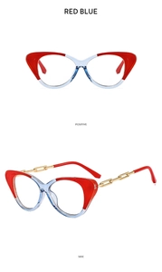 Detail of cat-eye frames with red blue contrast and gold metal chain temples