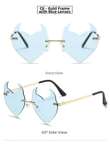 Detail of light blue heart-shaped rimless devil horn sunglasses with gold metal temples