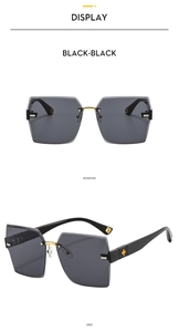 Front and side views of black rimless sunglasses with gold metal bridge and clover accents