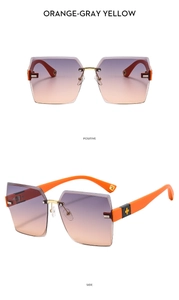 Frameless gradient sunglasses with orange-gray yellow lenses and gold star detail