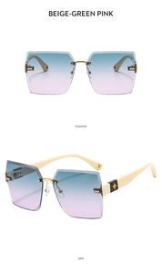 Detail view of rimless gradient lenses and gold hinge with black flower ornament