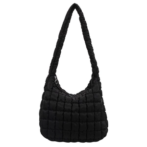 Detailed view of black quilted puffy hobo bag with zip closure and shoulder strap