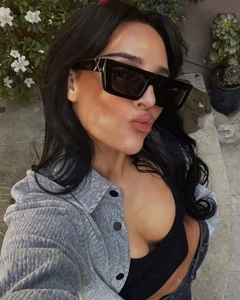 Fashionable black square sunglasses with decorative metal X detail on the temples