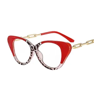 Cat eye blue light blocking glasses with red and leopard print frames and chain temples