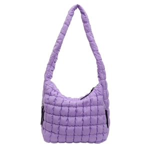 Detailed view of a trendy purple quilted bubble shoulder bag on a white background.
