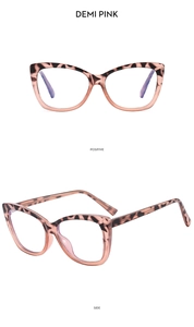 Detail of demi pink cat-eye glasses frame with clear tortoise shell texture and metal hinge