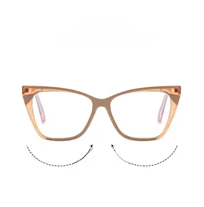 Detail of champagne cat-eye glasses with flexible hinges and metal rivet accents