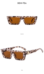 Detail of tortoise shell square sunglasses with golden metal X-shaped temple decoration