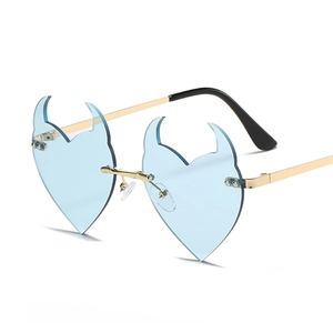 Trendy heart-shaped devil sunglasses with light blue lenses and gold metal frame