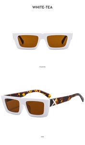 Detail view of white square sunglasses with tortoise temples and silver X logo