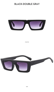 Detail of square sunglasses showing black frame, gradient lenses, and metal X hinge design