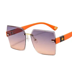 Frameless rimless clover sunglasses with sunset gradient lenses and bright orange temples