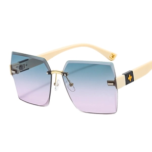 Fashion rimless oversized sunglasses with blue-purple gradient lenses and clover detail