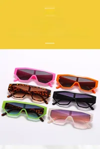 Close-up of geometric oversized sunglasses in six vibrant jelly colors and trendy flat top frames