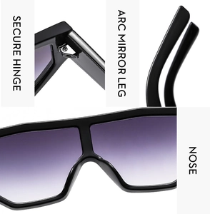 Detail view of reinforced metal hinges, arc temples and nose pads of black sport sunglasses