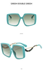 Detail view of turquoise oversized sunglasses with cutout temples and gradient lenses