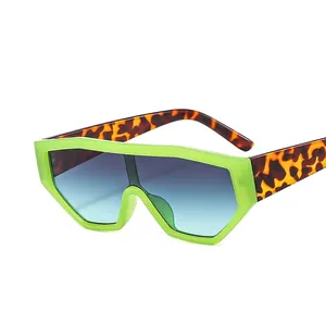 Neon green oversized geometric sunglasses with tortoiseshell temples and gradient lenses