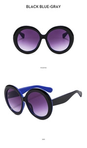 Front and side views of large round sunglasses with black-blue frames and purple lenses