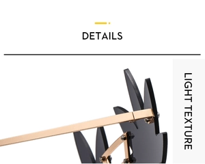 Detail of the golden metal hinge and maple leaf shaped lens on rimless sunglasses