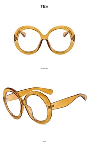 Detailed front and side views of oversized tea-colored round resin sunglasses frames