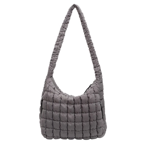Detailed view of grey quilted bubble shoulder bag with a high-capacity tote design
