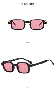 Detail view of square oversized sunglasses in black frame with pink-red lenses