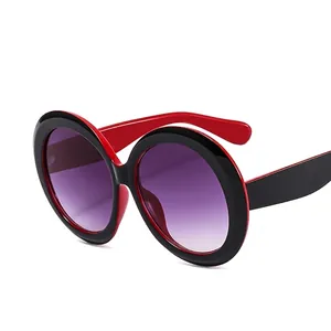 Classic round oversized sunglasses with black and red frame and purple gradient lenses
