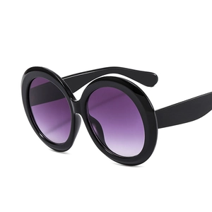 Chic oversized round sunglasses with thick black frames and purple gradient lenses