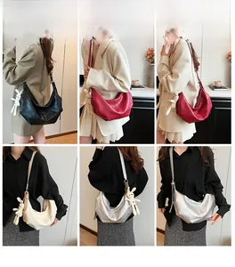 Collage of model carrying various geometric half-moon shoulder bags with rabbit charms