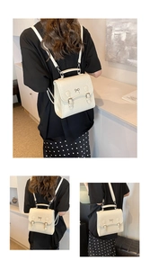 Detail eines cremeweißen PU-Leder-Rucksacks mit Webstruktur und Metall-Schleife