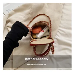 Detail view of the open red quilted mini chain bag showing internal storage capacity