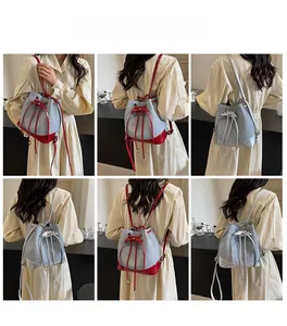 Multi-angle view of large color-block drawstring bucket bag with adjustable straps
