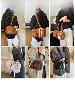 Bowling bag with lace ribbon detail shown in brown, beige, coffee, and black colors