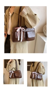 Detail view of coffee PU leather bowling bag featuring twin pockets and lace bow decoration