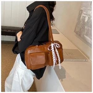 Brown retro tote bag with dual front pockets and delicate white lace ribbon detail