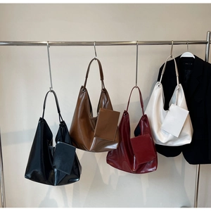 Hobo shoulder bag collection in four colors showing glossy texture and small zip pouches