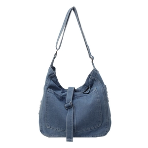 Retro washed blue denim crossbody bag with decorative metal buckles and external pocket