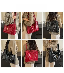 Detailed views of high-gloss patent leather tote bag with functional side zippers