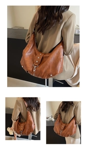 Detail of vintage brown leather hobo bag featuring metal star studs and adjustable strap