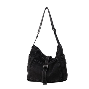 Fashionable black denim crossbody bag with adjustable strap and vintage frayed edge detail