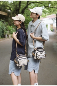 Side view of outdoor casual crossbody bags with adjustable straps and multi-pocket design