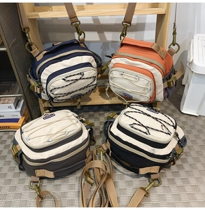 Detail of multi-functional crossbody bags with elastic cords and nylon textures