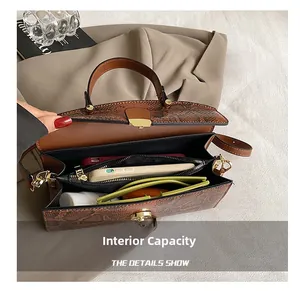 Macro view of large tote bag internal capacity showing compartments and black lining