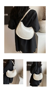 Close-up of quilted cream crescent bag with elegant diamond stitching and PU leather detail